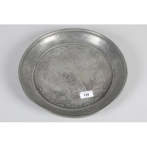 139 - Mid 20th century Chinese Huikee pewter dish; engraved with flying dragon over the sea; 32cm diameter... 