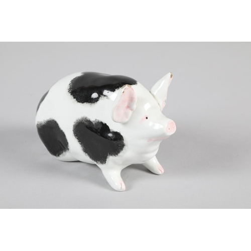 14 - Wemyss pottery black and white seated pig; marks to base; 10cm high