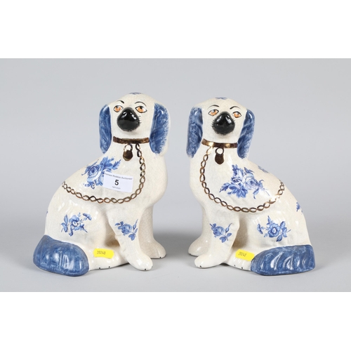 5 - Pair of Staffordshire ware pottery seated blue and white dogs; 21cm high