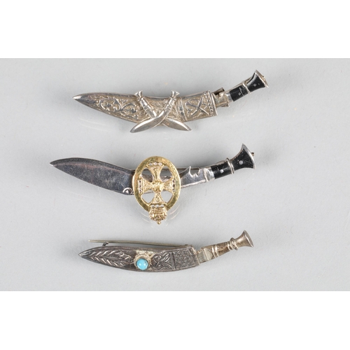 69 - Three white metal Kukri tie pins (3)