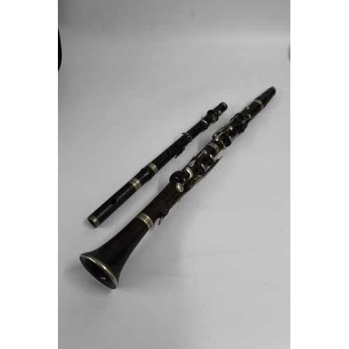 231 - Picolo with nickel mounts and keys, 38cm long and a clarinet.