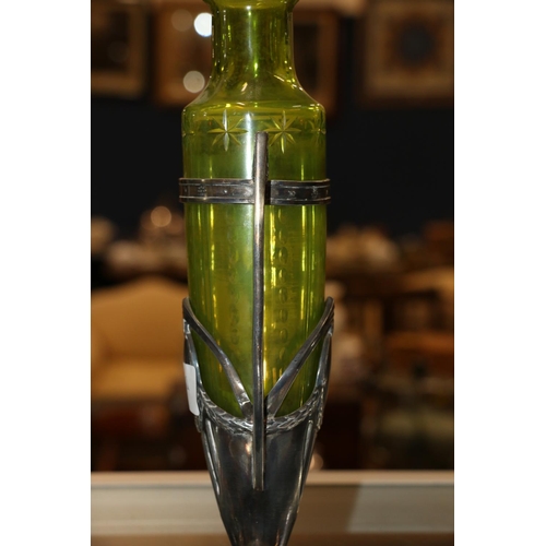 100Q - WMF art nouveau style green glass vase within twin handled white metal holder, 29cm.