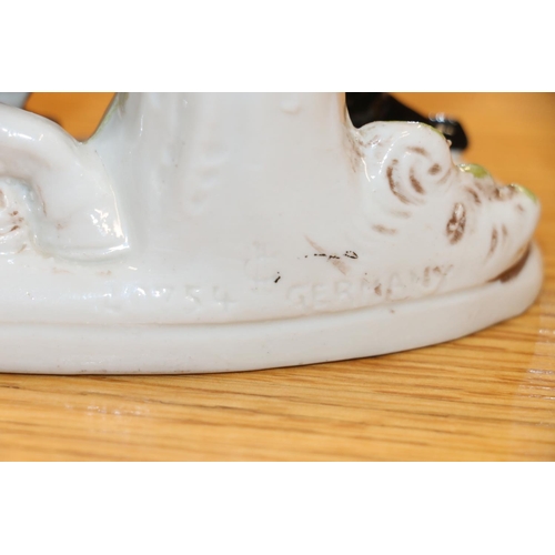 97 - Pair of continental porcelain rearing horse models, 18cm.