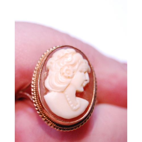 35 - Cameo ring, another, cabochon amethyst, 1978, another, opal, and a knot ring, all 9ct gold.  (4... 