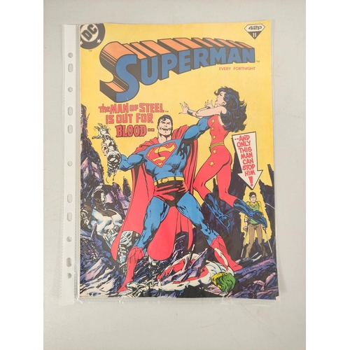 104 - Carton containing a selection of twenty five various 1980s Superman comics and nine The Superheroes ... 