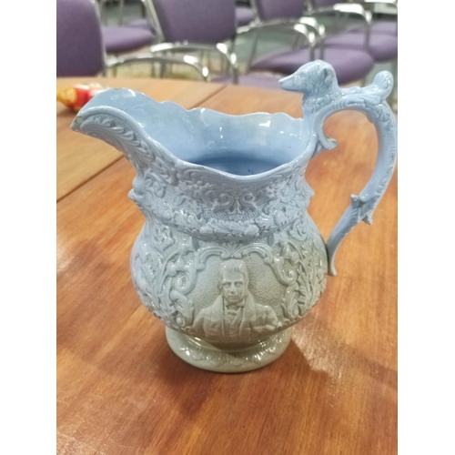 51 - Victorian relief decorated jug depicting Robert Burns and Sir Walter Scott.