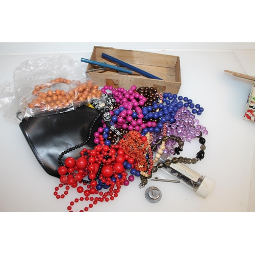 497 - Costume jewellery to include beaded necklaces, badges, etc.