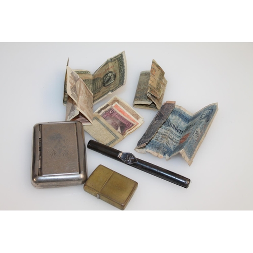 499 - Collection of banknotes, a lighter and a cigarette case.