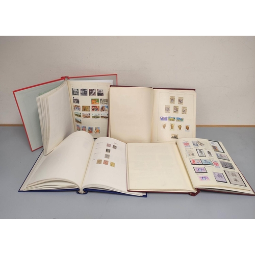 214 - Four collector's postage stamp albums comprising of Commonwealth and World issues. To include issues... 