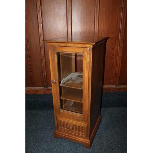 528 - Ercol style oak music cabinet, 96cm high.