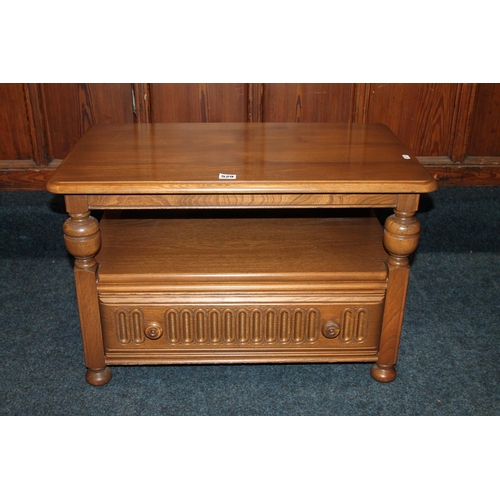 529 - Ercol oak television stand with base drawer, 74cm wide.