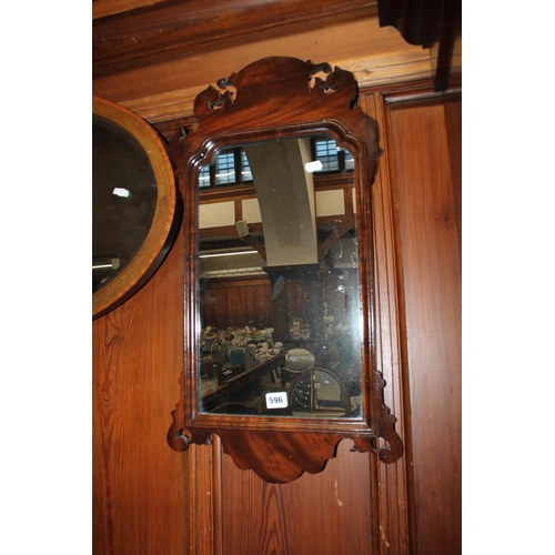 596 - Mahogany fret carved wall mirror 70cm x 38cm.