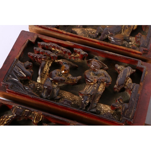 122 - Five Chinese lacquered & gilded panels with carved figural scene decoration.