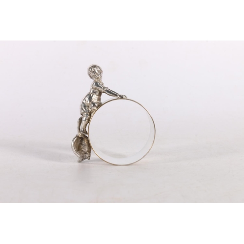 36 - Novelty silver plated napkin ring decorated with girl being chased by a goose.