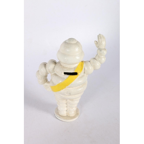 39 - Cast metal model of the Michelin man, 22cm.