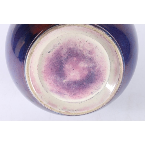 96 - Moorcroft purple lustre spherical bowl, 15cm.