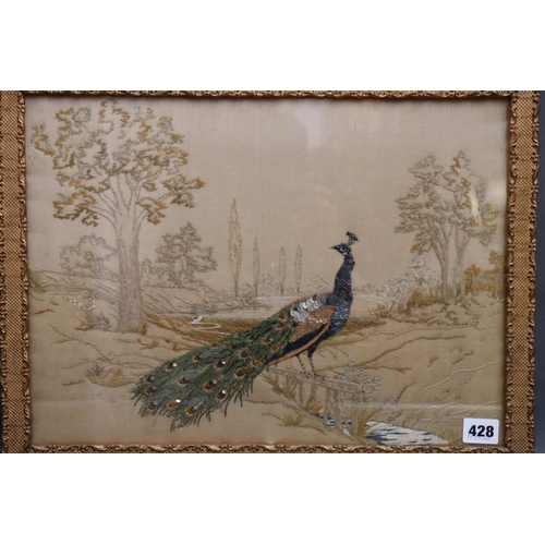 428 - 19th century needlework depicting a peacock in a landscape, 31cm x 42cm, frame 36cm x 47cm.