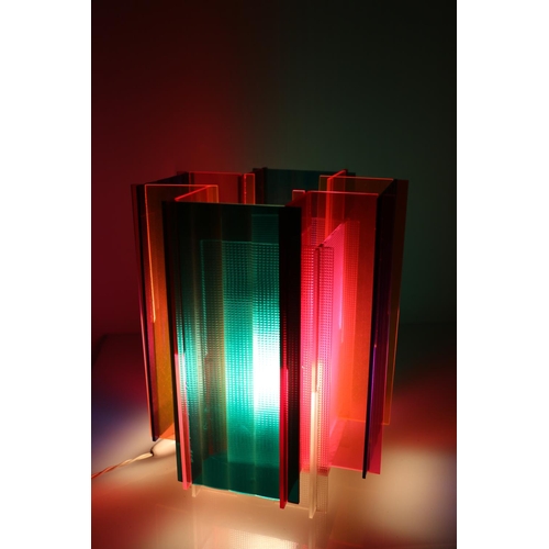 104 - Stylish lamp constructed from coloured sheets of perspex, 27cm.