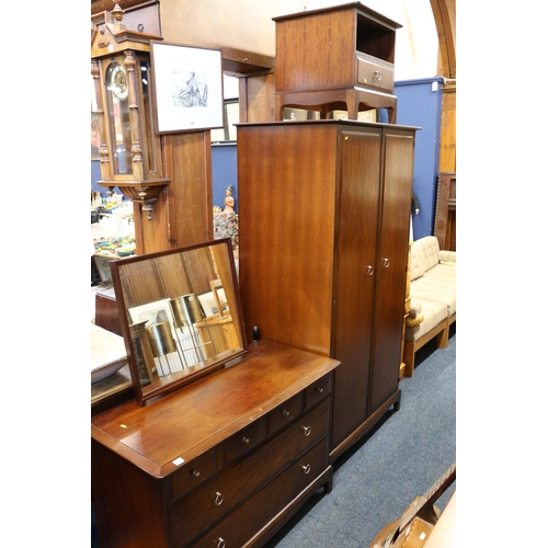 605 - Stag four piece bedroom suite comprising wardrobe, dressing chest, bedside chest and a headboard