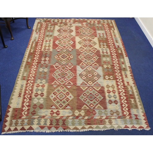 502 - Large Kelim flat weave carpet in red, cream and grey, the main field with ten panels of diamond loze... 