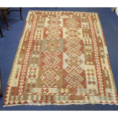 502 - Large Kelim flat weave carpet in red, cream and grey, the main field with ten panels of diamond loze... 