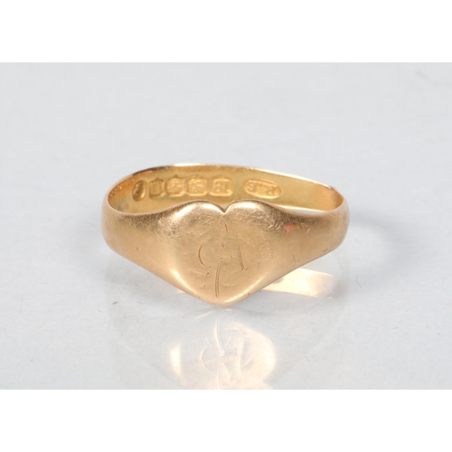 64 - 18 carat yellow gold 'heart' signet ring; ring size Q; 3.7g gross weight