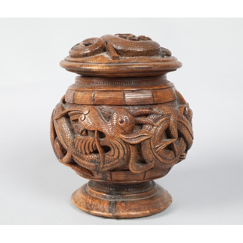 187 - 19th / 20th century heavily carved Chinese hardwood tobacco jar and cover; with dragon decoration; 1... 