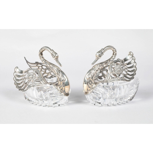 194 - Pair of 20th century hallmarked silver mounted and glass swan table salts; bearing import marks; 10c... 