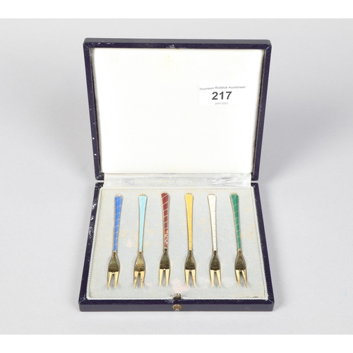 217 - Cased set of six Danish Harlequin enameled silver gilt pastry forks; 10cm long