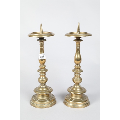 268 - Pair of 18th / 19th century turned brass pricket candlesticks; 34cm high