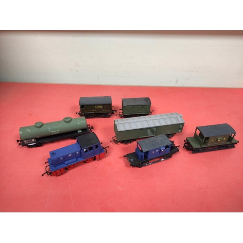 64 - Box of 00 gauge carriages and locomotives comprising of mostly Triang models to include a R114 box c... 