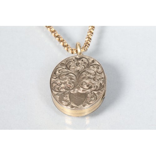 93 - 9 carat yellow gold engraved oval pendant; on a 9 carat yellow gold chain; 15.4g gross weight