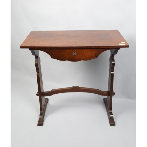 491 - Walnut veneered single drawer trestle table; 80cm wide