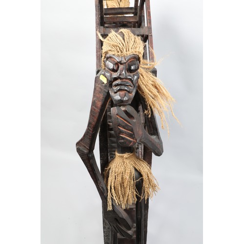 485 - Floor standing carved African / Tribal folding bottle stand; 118cm high