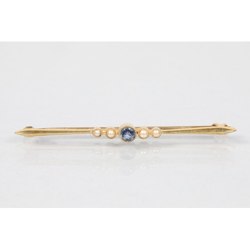 108 - 18 carat yellow gold mounted sapphire and seed pearl set bar brooch; 5.5cm long; 2.4g gross weight