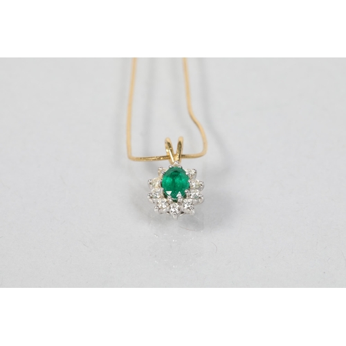 110 - Emerald and diamond pendant; on an 18 carat yellow gold chain; 4.7g gross weight