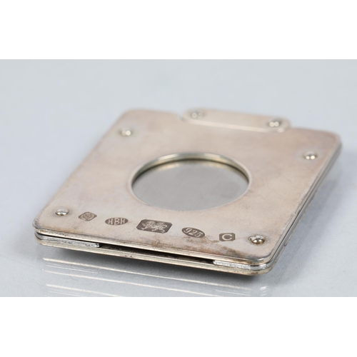 114 - Contemporary Elizabeth II hallmarked silver cigar cutter; Sheffield 2002; 44g gross weight 