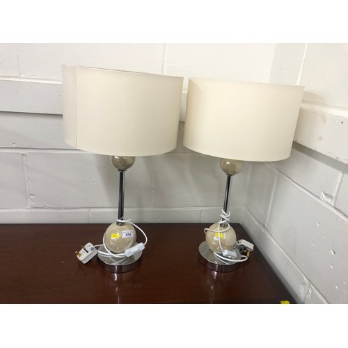 614 - Pair of chrome and pottery table lamps