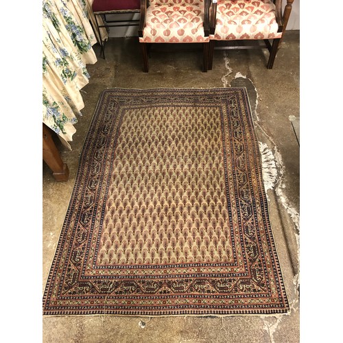 639 - Red and beige ground rug; with geometric pattern, 152 x 81 cm