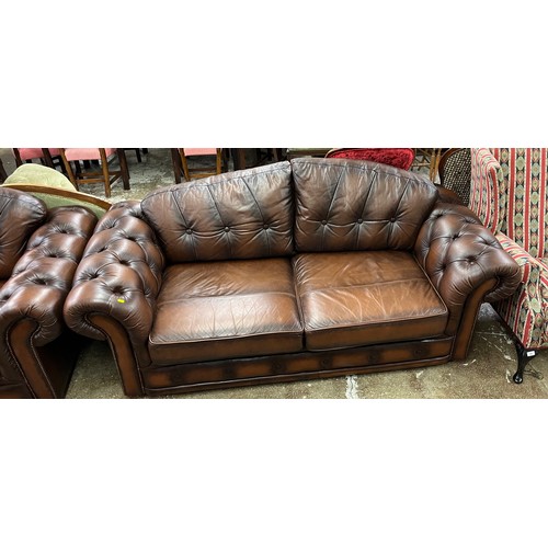 595 - Two seated leather sofa with pair of matching arm chairs and matching foot stool