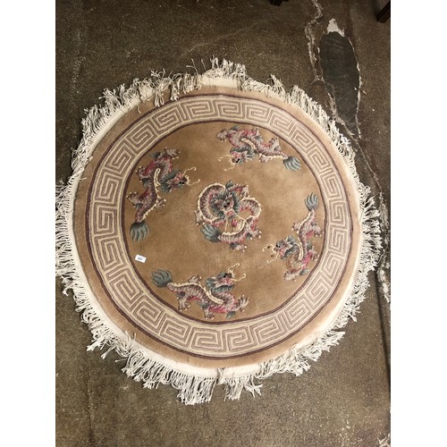 637 - Chinese beige ground circular rug