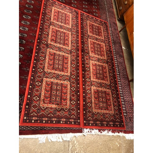 635 - Pair of Eastern wool red ground runners, 248 x 80 cm