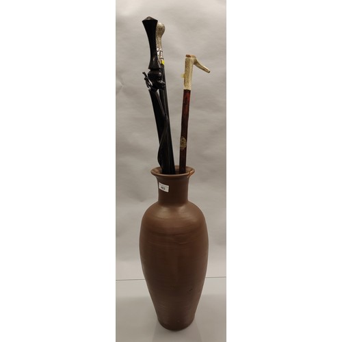 483 - Large baluster stoneware vase with three various walking sticks