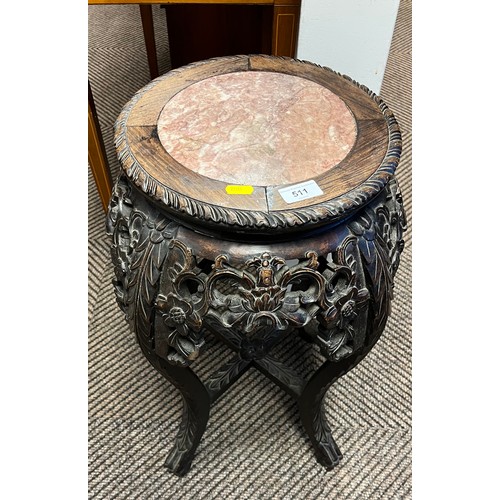 511 - Carved Chinese hardwood and marble stand; raised on outswept supports; 62cm high