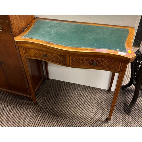 512 - Edwardian crossbanded mahogany serpentine fronted leather topped fold over games table with two draw... 