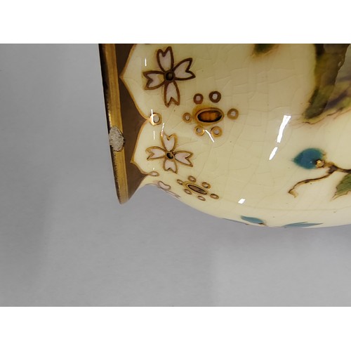 11 - 20th century Zsolnay Pecs porcelain twin handled vase; decorated with flowers; 28cm high