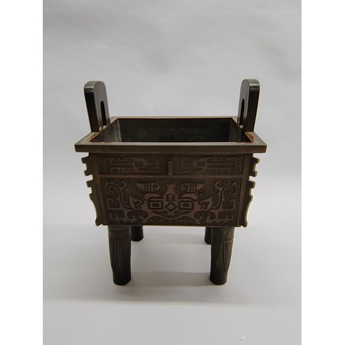 264 - Large Chinese bronze rectangular censer and cover; surmounted with Dog of Fo; with Greek Key and mas... 