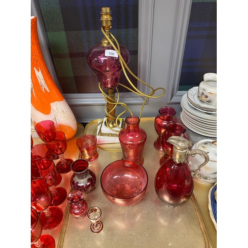 336 - Assortment of cranberry glass including, lamp  and other glassware including large orange and white ... 