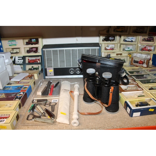 208 - Decca 200 speaker, a cased set of Regent binoculars, a Yamaha recorder, and bottle openers.