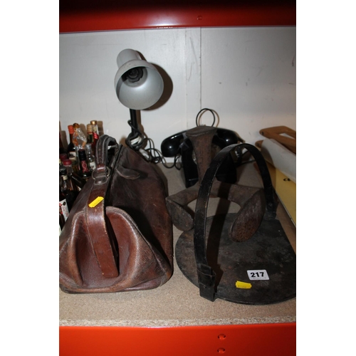 217 - Gladstone bag, a cobblers last, a vintage telephone, a griddle pan and a desk lamp.